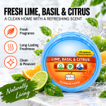 Lime, basil and citrus scented scouring paste in blue packaging with fresh citrus fruit and green basil leaves
