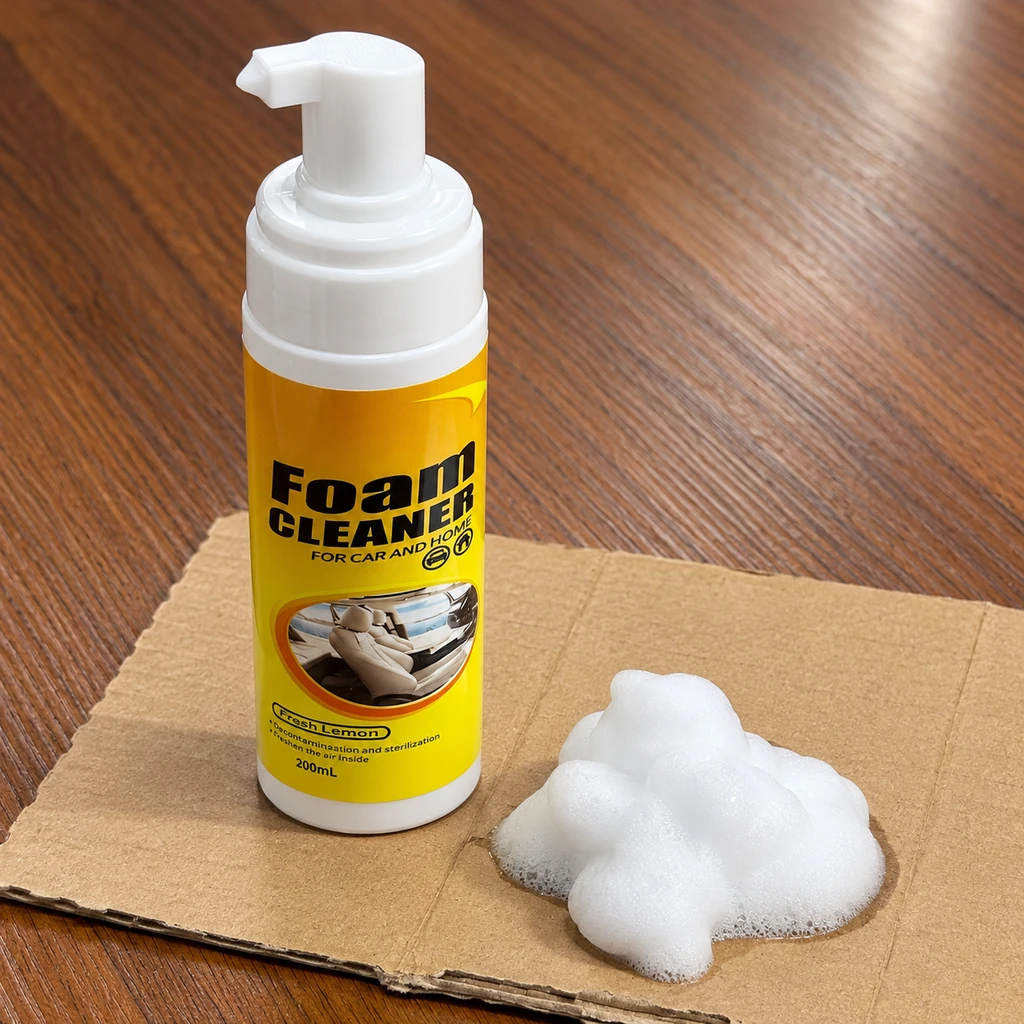 Foam cleaner pump bottle with a sample of white foam on cardboard over a wooden tabletop